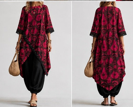  loose, long tunic top with a bold magenta and black floral pattern, paired with black harem pants
