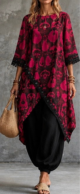 bohemian-style tunic top with a vibrant magenta and black ikat pattern, paired with black harem pants